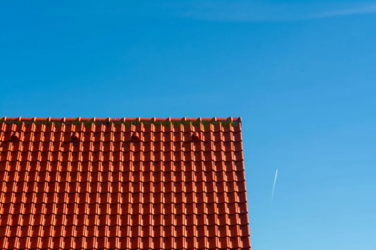 Tile roof gable in full sun, the kind of exposure that sets roof life in Champaign, IL